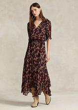 Load image into Gallery viewer, Model working Polo Ralph Lauren - Floral Tie-Neck Georgette Dress in Fall Poppy Floral.
