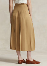 Load image into Gallery viewer, Model wearing Polo Ralph Lauren - Satin Pleated A-Line Midi Skirt in Camel - back.

