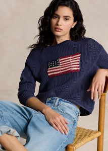 Model wearing Polo Ralph Lauren - Flag Pointelle Cotton-Linen Sweater in Blue Multi.