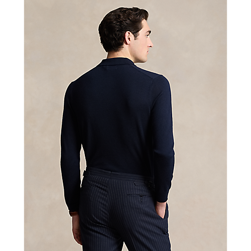 Model wearing POLO Ralph Lauren - LS Merino Wool Button Placket Polo Sweater in Hunter Blue - back.