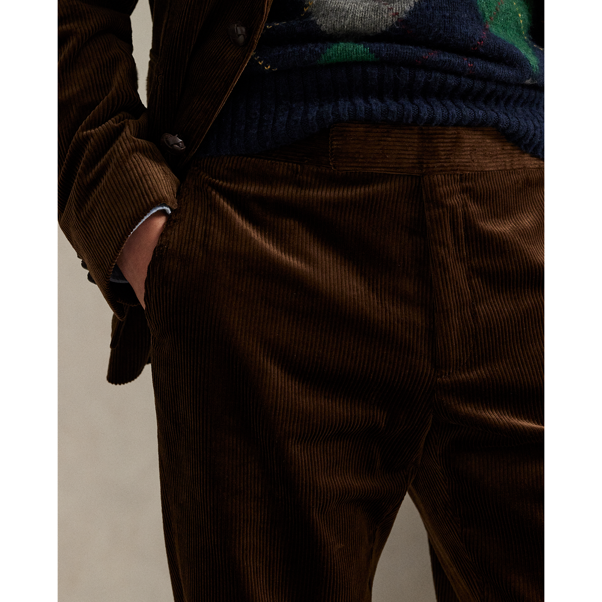 Model wearing POLO Ralph Lauren - 8 Wale Corduroy Chester Trouser in Chestnut.