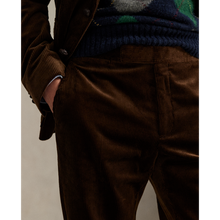 Load image into Gallery viewer, Model wearing POLO Ralph Lauren - 8 Wale Corduroy Chester Trouser in Chestnut.

