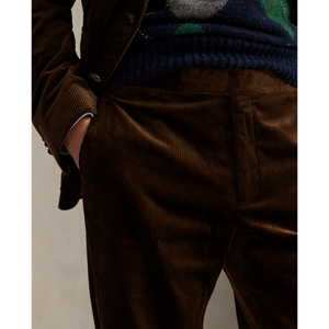 Model wearing POLO Ralph Lauren - 8 Wale Corduroy Chester Trouser in Chestnut.