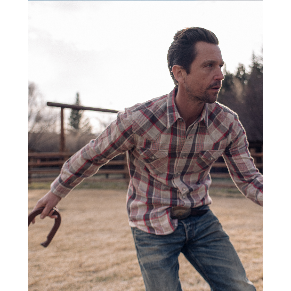 Model wearing RRL - LS Buffalo Western Shirt Plaid in Red/Cream Multi.