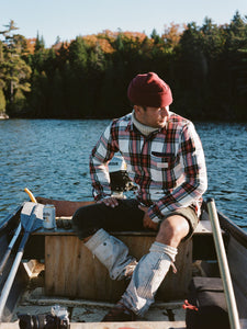 Model wearing Amundsen - Skauen Field Shirt in chequered red.