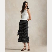 Load image into Gallery viewer, Model wearing Polo Ralph Lauren - Poly Satin Polka Dot Maxi Pencil Skirt in Polka Dot Black/White.
