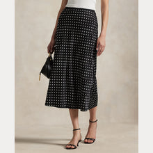 Load image into Gallery viewer, Model wearing Polo Ralph Lauren - Poly Satin Polka Dot Maxi Pencil Skirt in Polka Dot Black/White.
