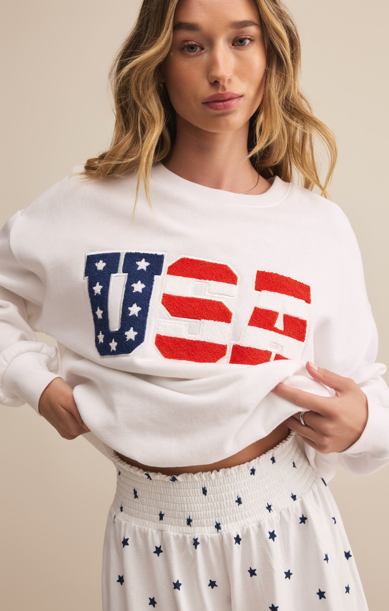 Model wearing ZSupply - Oversized USA Sweatshirt in White.