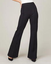 Load image into Gallery viewer, Model wearing Spanx - The Perfect Pant, Hi-Rise Flare in Classic Black 20252R.
