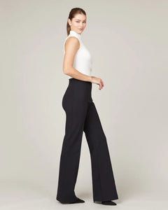 Model wearing Spanx - The Perfect Pant, Hi-Rise Flare in Classic Black 20252R.