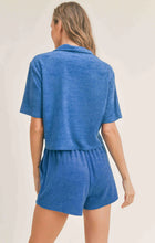 Load image into Gallery viewer, Model wearing Sadie &amp; Sage - Pool Day Terry Crop Shirt in Blue - back.
