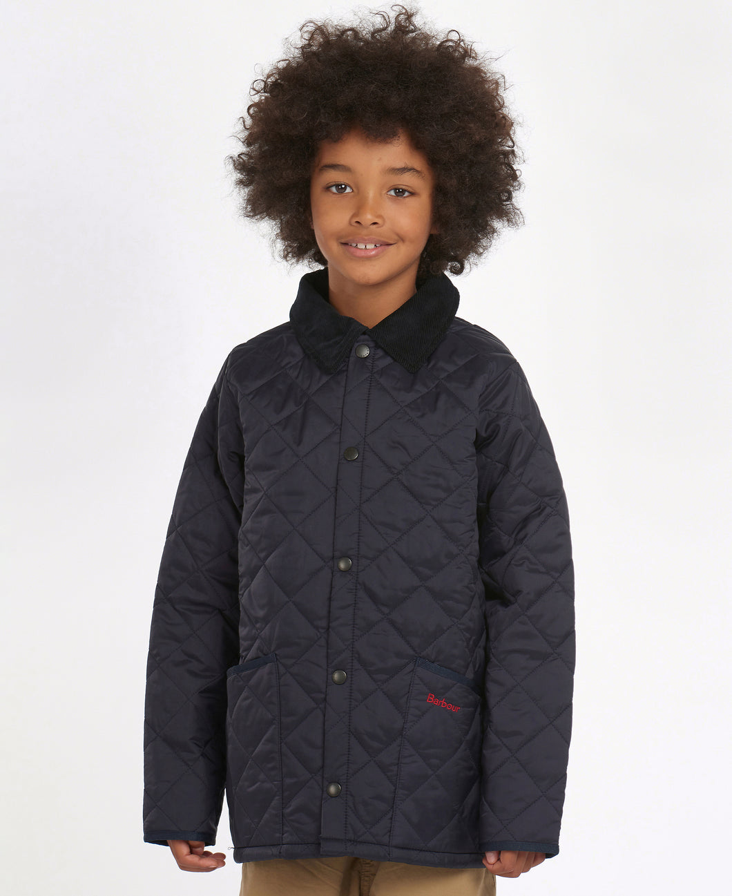 Model wearing Barbour Youth Liddesdale Quilt in Navy.