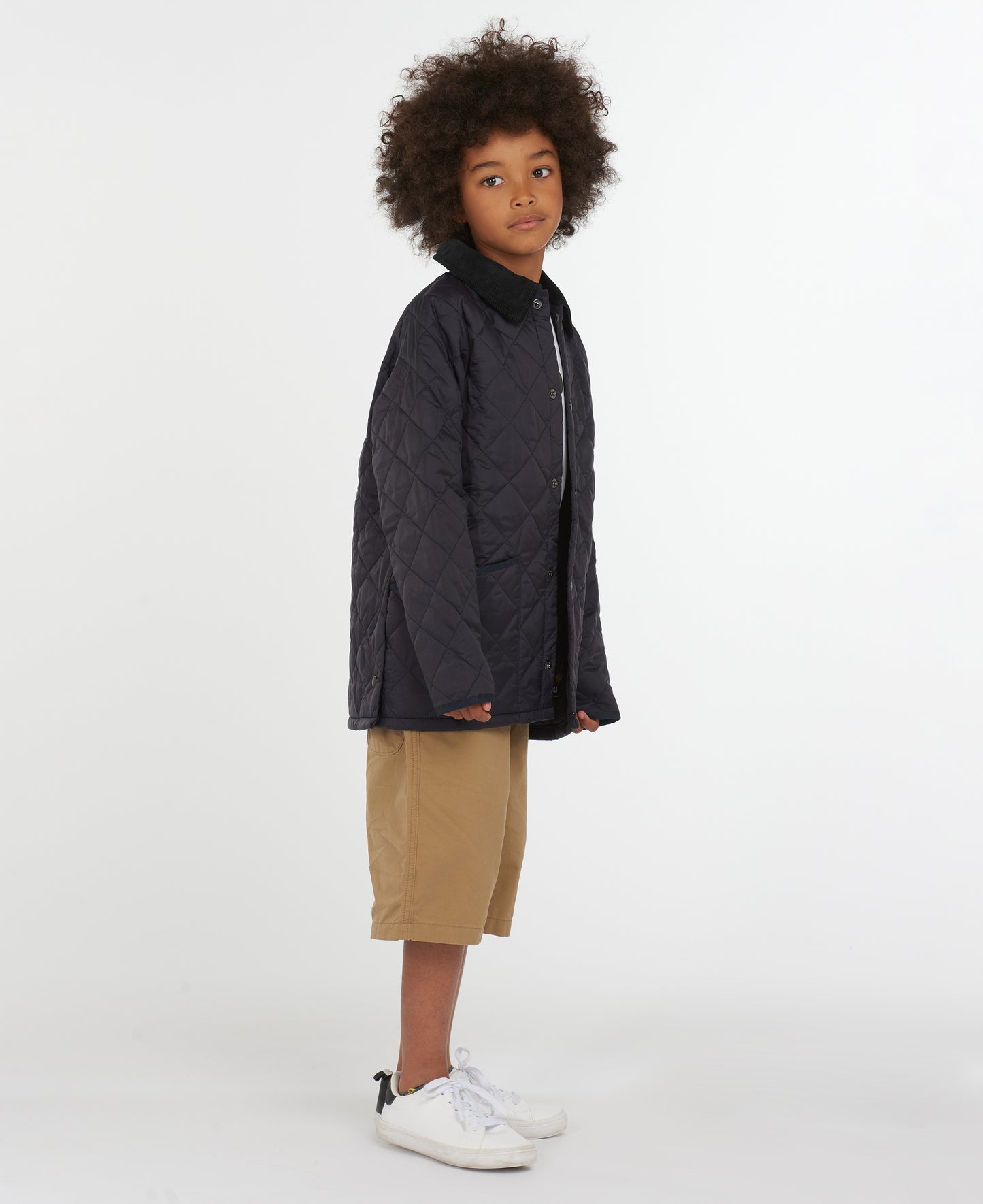 Model wearing Barbour Youth Liddesdale Quilt in Navy.