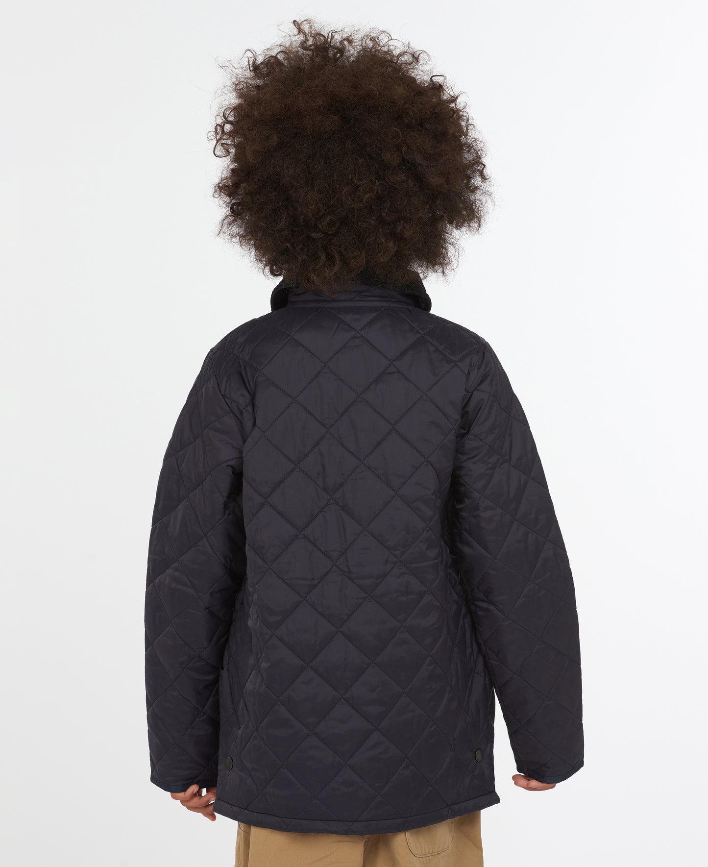 Model wearing Barbour Youth Liddesdale Quilt in Navy.