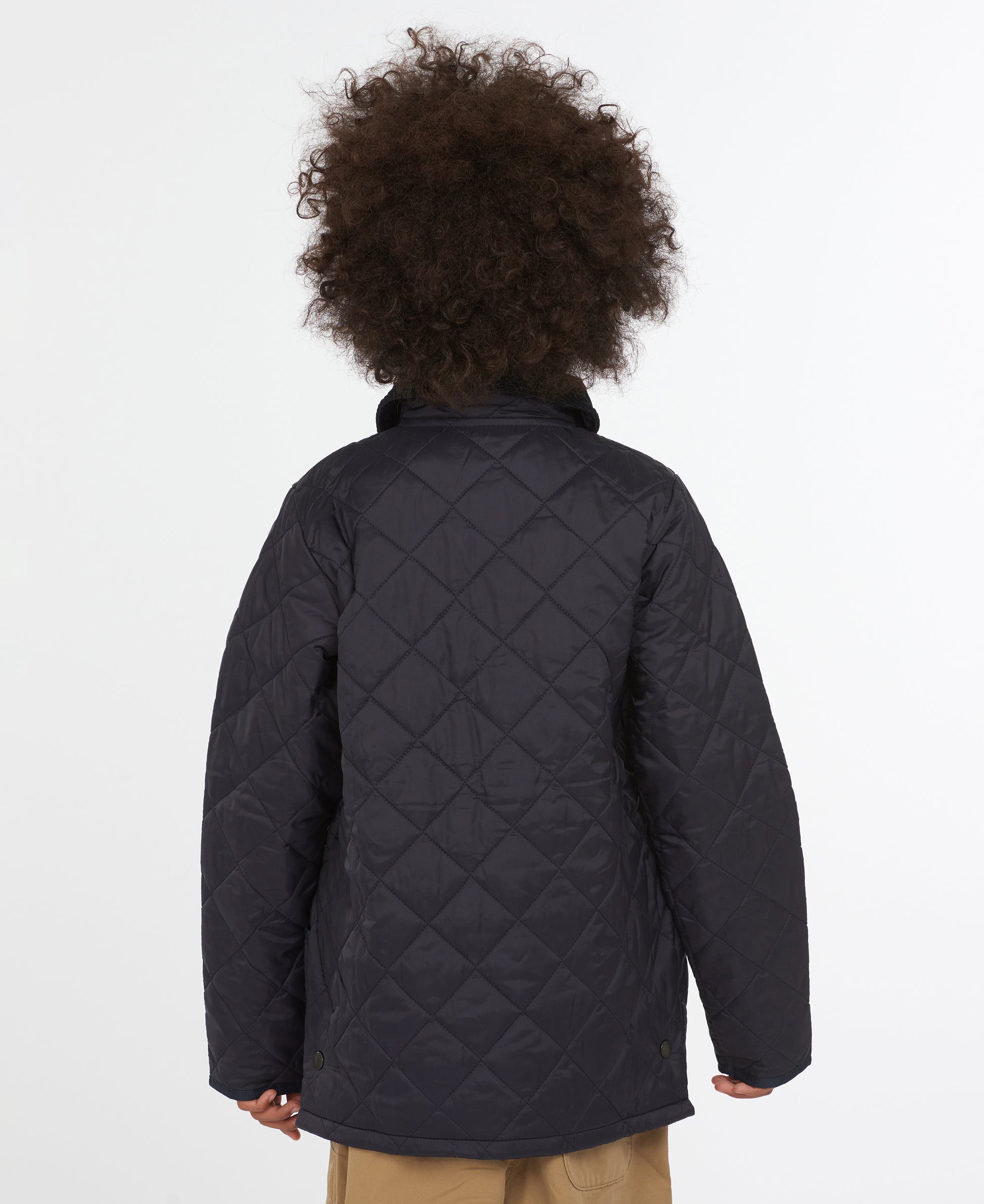 Model wearing Barbour Youth Liddesdale Quilt in Navy.