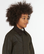 Load image into Gallery viewer, Model wearing Barbour Youth Beaufort Jacket in Olive.
