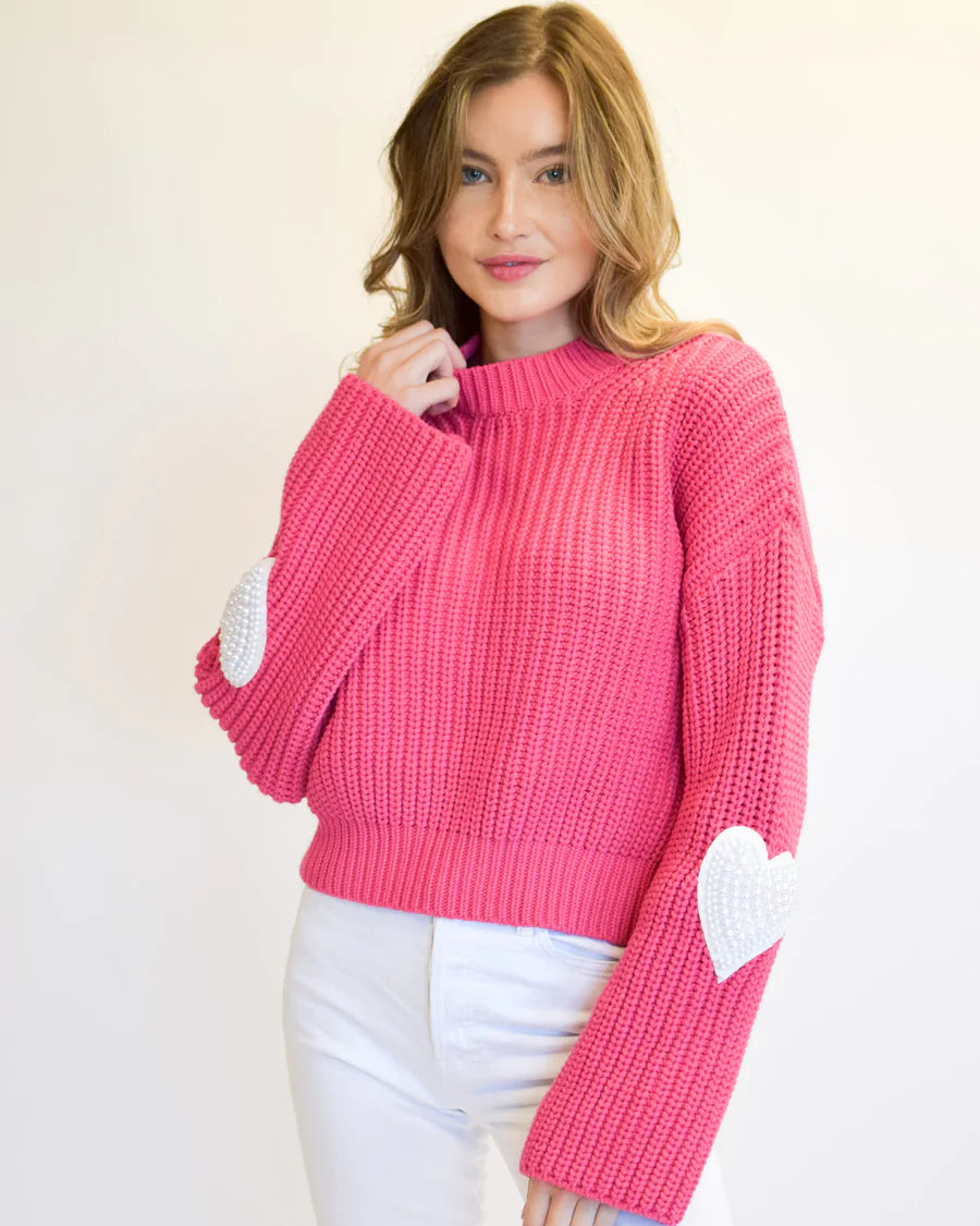 Model wearing Never A Wallflower - Bell Sleeve Crew Neck Valentine's Day Sweater in Lipstick.