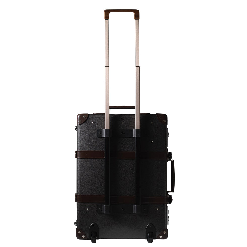 Globe-Trotter Deluxe 20" Trolley case in Caviar and Brown with arms extended.