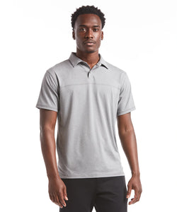 Model wearing Public Rec - Elevate Polo in Heather Steel.