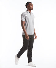 Load image into Gallery viewer, Model wearing Public Rec - Elevate Polo in Heather Steel.
