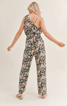 Load image into Gallery viewer, Model wearing Sadie &amp; Sage - Getaway Garden One Shoulder Jumpsuit in Black Multi - back.

