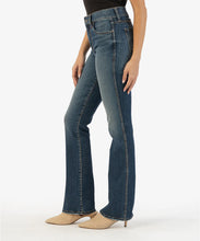 Load image into Gallery viewer, Model wearing Kut From The Kloth - Natalie High Rise Fab Ab Bootcut KP1235MB8 in Allied Wash.
