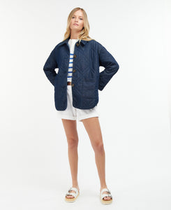 Model wearing Barbour Denim Barrhead Quilt in Dark Was/Dress Indigo.