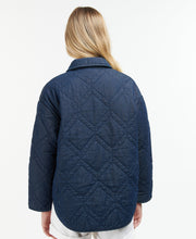 Load image into Gallery viewer, Model wearing Barbour Denim Barrhead Quilt in Dark Was/Dress Indigo - back.
