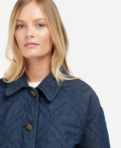 Model wearing Barbour Denim Barrhead Quilt in Dark Was/Dress Indigo.