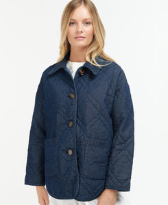 Model wearing Barbour Denim Barrhead Quilt in Dark Was/Dress Indigo.