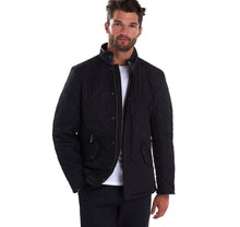 Load image into Gallery viewer, Model wearing Barbour Powell Quilt jacket in black.
