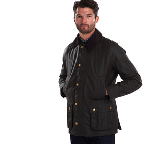 Model wearing a Barbour Ashby waxed jacket in olive.