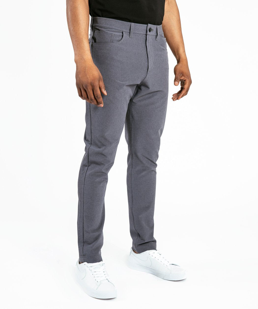 Model wearing Public Rec Workday Pant straight leg in slate.