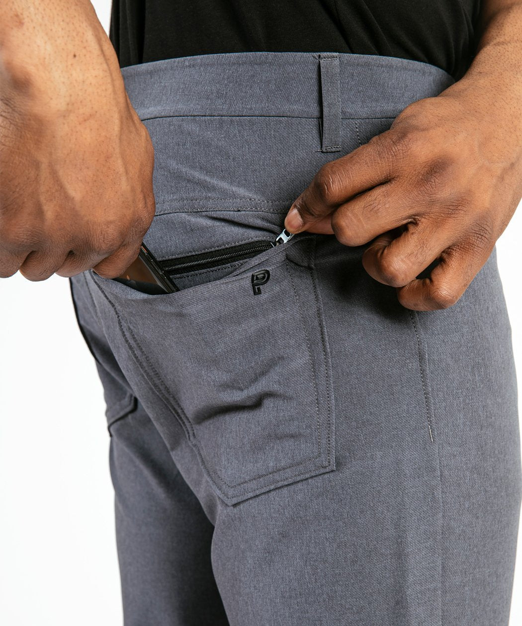 Model wearing Public Rec Workday Pant straight leg in slate.