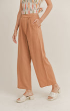Load image into Gallery viewer, Model wearing Sadie &amp; Sage - Out West Linen Pants in Tan.
