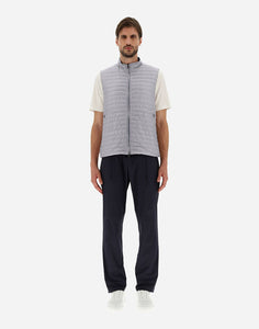 Model wearing Herno Men's Nylon Ultralight Reversible Two Tone Waistcoat in Blue Navy/Light Grey.