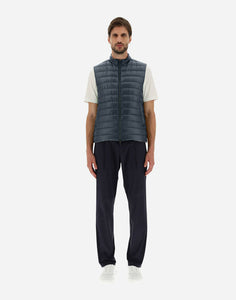 Model wearing Herno Men's Nylon Ultralight Reversible Two Tone Waistcoat in Blue Navy/Light Grey.