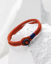 Load image into Gallery viewer, Pig &amp; Hen Don Dino bracelet in coral red with black ring.
