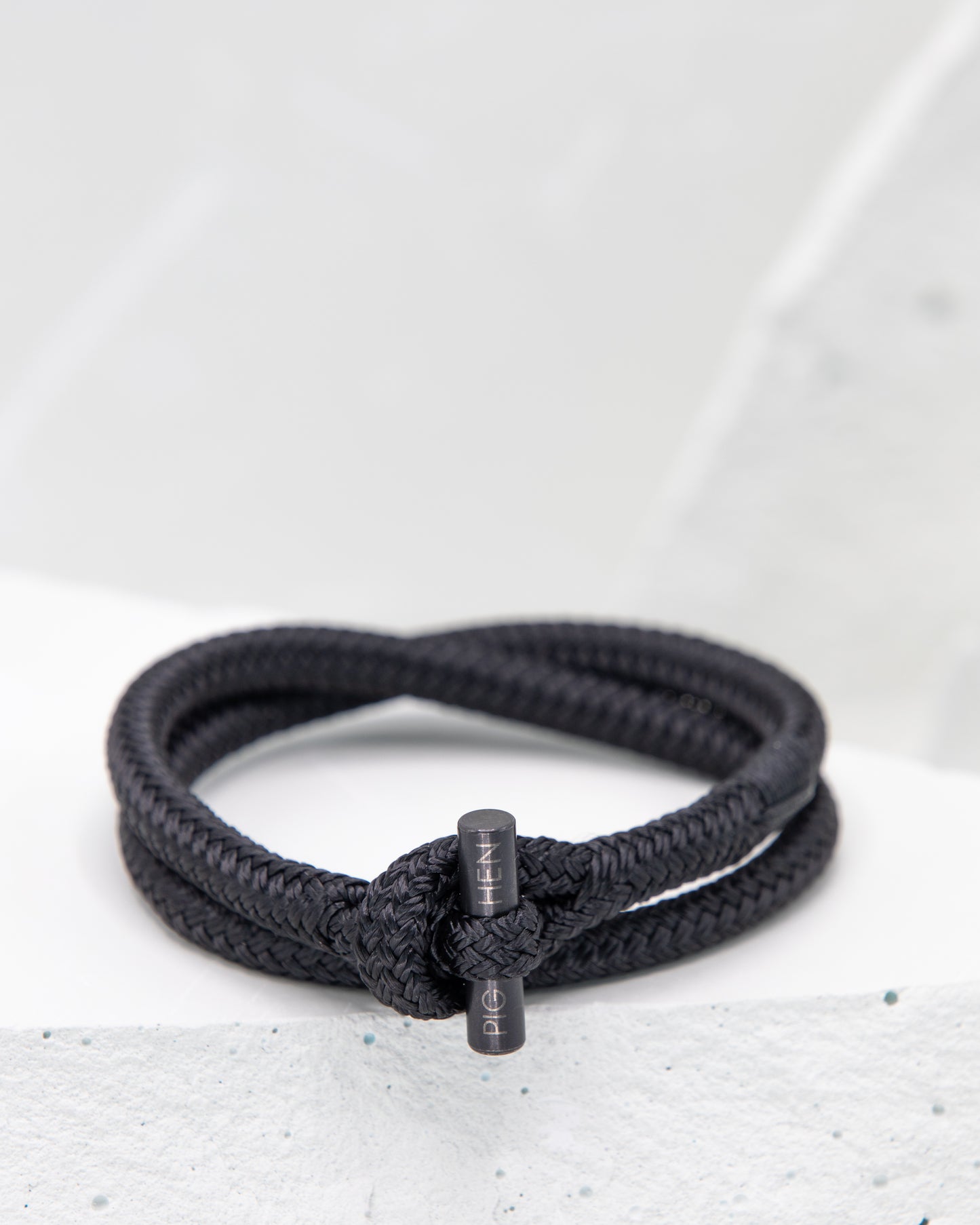 Pig & Hen Tiny Ted black with black buckle bracelet.