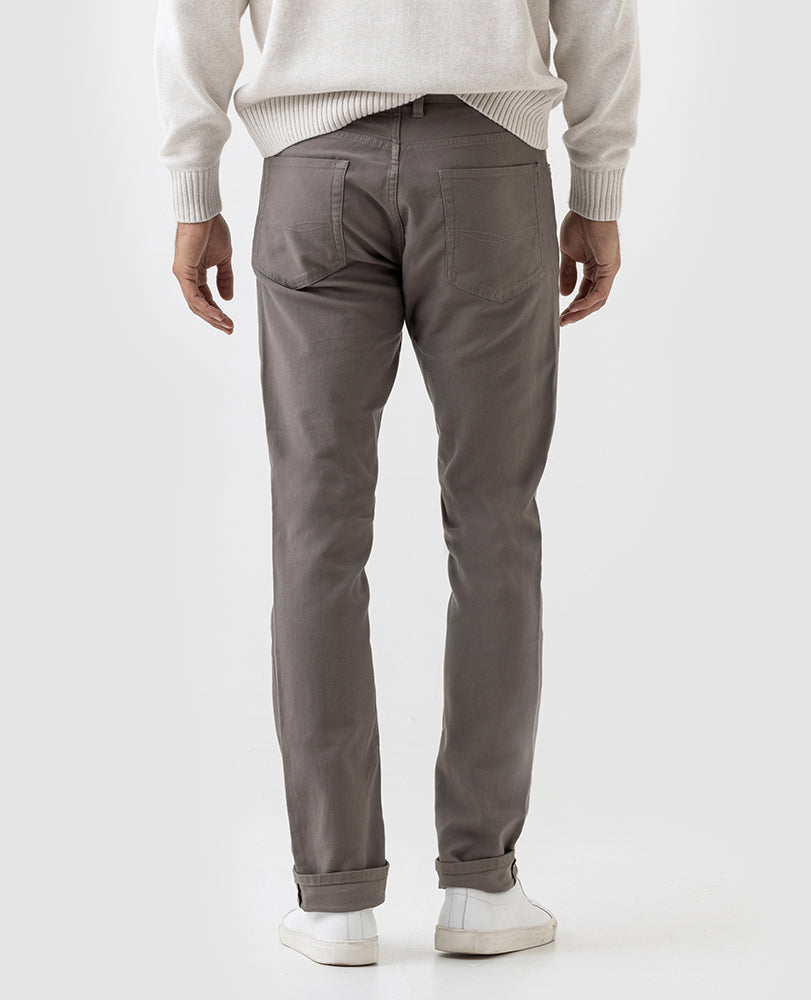 Model wearing Rodd & Gunn Motion 2 Straight Jean in Pebble.