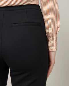 Model wearing Spanx - The Perfect Pant, Slim Straight in Classic Black 20254R - back.