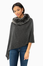 Load image into Gallery viewer, Model wearing Alashan - 100% Cashmere LUXE Windchill Fox Trim Topper in Charcoal.

