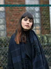 Load image into Gallery viewer, Model wearing Begg &amp; Co - Vale Blackadder Lambswool Cashmere Scarf in Black.
