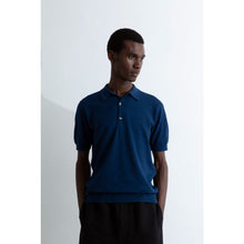 Load image into Gallery viewer, Model wearing John Smedley - Adrian S/S Polo Shirt in Indigo.
