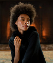 Load image into Gallery viewer, Model wearing Alashan - 100% Cashmere LUXE Windchill Fox Trim Topper in Ebony.
