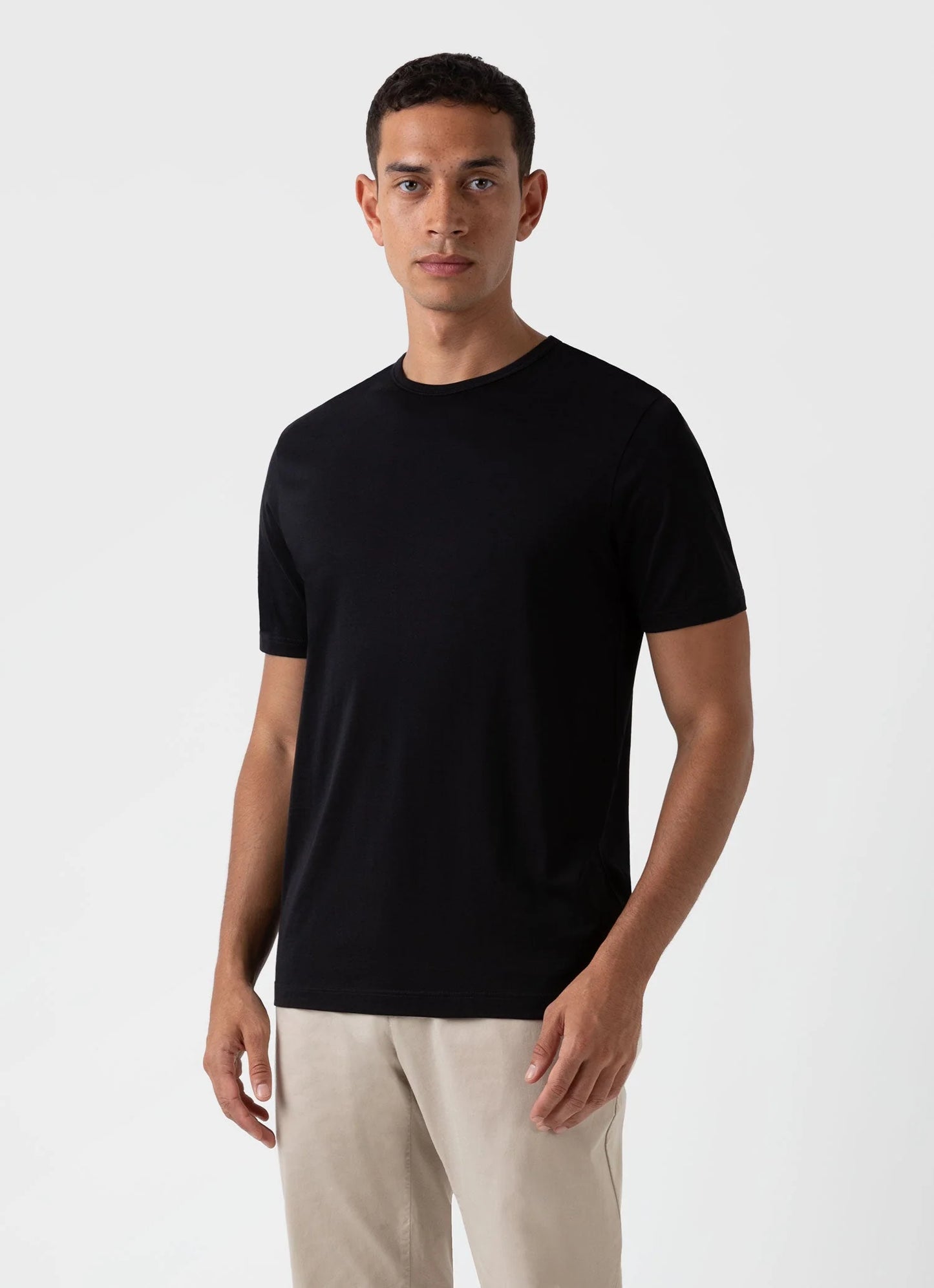 Model wearing Sunspel - Classic Crew Neck T-Shirt in Black.