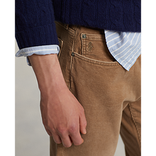 Load image into Gallery viewer, Model wearing Polo Ralph Lauren - Varick Slim Straight Stretch Corduroy 5-Pocket Pant in Vintage Tan.
