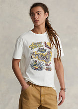Load image into Gallery viewer, Model wearing POLO Ralph Lauren - Classic Fit Jersey Graphic T-Shirt in Deckwash White.
